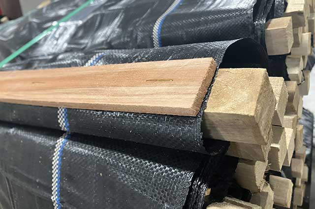 zoomed in image of talon fabric fencing product rolled up prior to installation