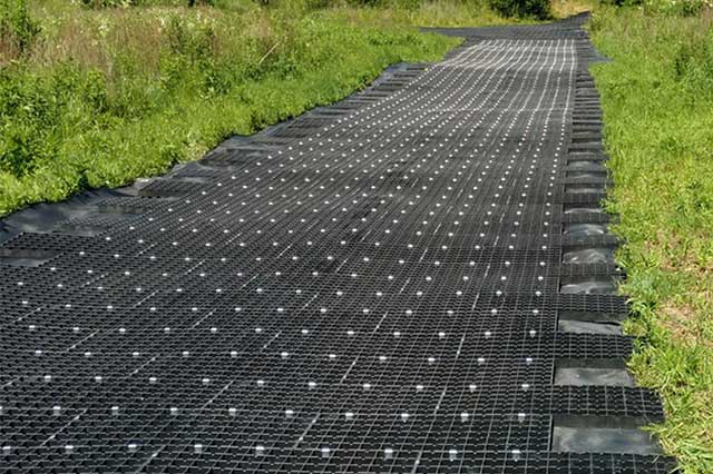 talon fabrics base mat strip in grass field