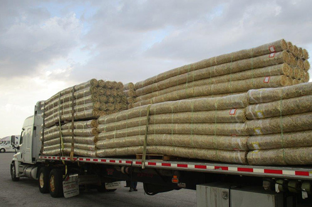 delivery truck hauling erosion control materials 