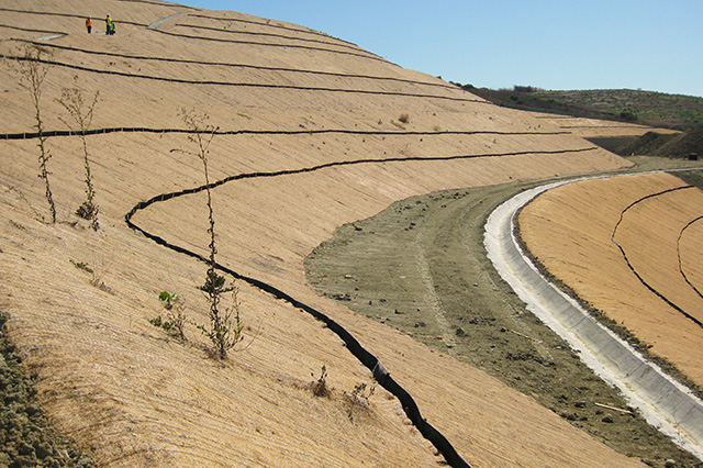 Erosion and sediment control products installed on sloped ground